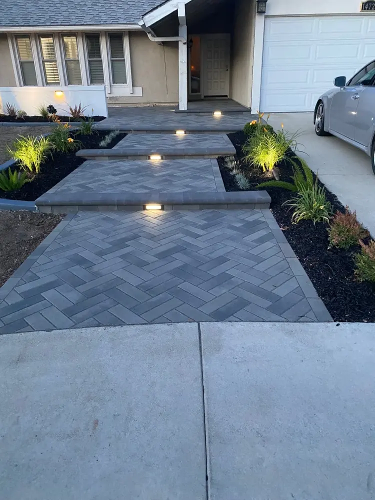 Paver walkway with low-voltage lighting and new planters